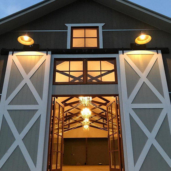 Gooseneck lights and hardwood scissor trusses | Wedding Venue Gold Coast